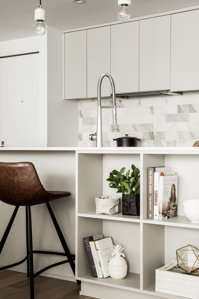 Cube storage in kitchen on kitchen island with decor 